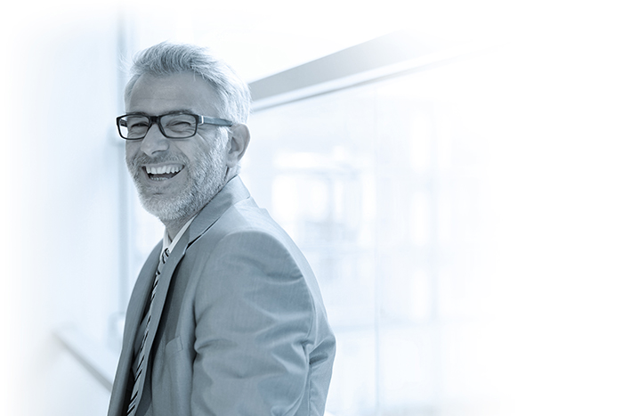 Laughing mature businessman in office looking at camera Pavilion Service