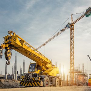 Mobile Crane on a road and tower crane in construction site